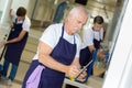 Cleaners working with cleaning equipments Royalty Free Stock Photo