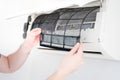 Cleaning air conditioner filter on the wall at home for hvac service Royalty Free Stock Photo