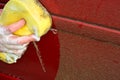 Cleaning automobile with soapy sponge