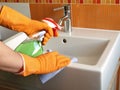 Cleaning bathroom sink Royalty Free Stock Photo