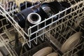 Cleaning camera and lenses in the dishwasher Royalty Free Stock Photo