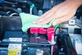 Cleaning the car engine with green microfiber cloth Royalty Free Stock Photo