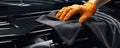 Cleaning the car engine with a microfiber cloth. generative ai Royalty Free Stock Photo