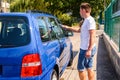 Cleaning the car glass, a man wipes excess water from the glass in the car Royalty Free Stock Photo