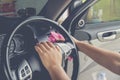 Cleaning car light switch control from the dust . Royalty Free Stock Photo