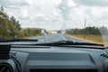 Cleaning the car`s windshield with a windscreen wiper Royalty Free Stock Photo