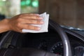 Cleaning Car steering whee with disinfecting wet wipes Royalty Free Stock Photo