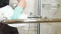 Cleaning chrome-plated bathrooms, bidets. polishing crane and handles. Cleaning in hotel. Close-up shot of maid from