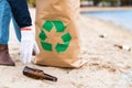 Volunteer cleaning beach from trash Royalty Free Stock Photo