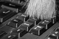 0618 Cleaning the computer keyboard with a brush in black white