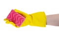 Cleaning concept - hand in a yellow rubber glove holds a pink sponge Royalty Free Stock Photo