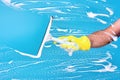 Cleaning conept - hand cleaning glass window pane with detergent Royalty Free Stock Photo