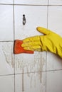 Cleaning of dirty old tiles in a bathroom Royalty Free Stock Photo