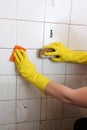 Cleaning of dirty old tiles in a bathroom Royalty Free Stock Photo