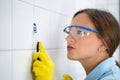 Cleaning Dirty Tile Grout In Bathroom Royalty Free Stock Photo