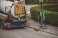 Cleaning water drains on a street Royalty Free Stock Photo