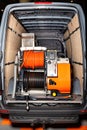 High-pressure cleaning equipment installed in van interior with hoses and cleaning tools organized for efficient work, industrial Royalty Free Stock Photo