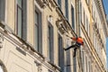 Cleaning the facade of the building during the day Royalty Free Stock Photo