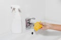 Cleaning the faucet cleaning products. The cleanliness in the house Royalty Free Stock Photo