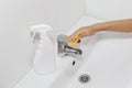 Cleaning the faucet cleaning products. The cleanliness in the house Royalty Free Stock Photo