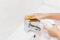 Cleaning the faucet cleaning products. The cleanliness in the house Royalty Free Stock Photo