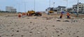 Cleaning the filthy beach of Versova in tropical Mumbai Royalty Free Stock Photo