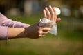 Cleaning fingers and hands with wet wipes against disease infection like flu or influenza Royalty Free Stock Photo