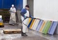 Cleaning fish containers Royalty Free Stock Photo