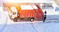 Cleaning and garbage collection on a cargo garbage truck in the winter. Garbage sorting, copy space Royalty Free Stock Photo