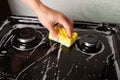 Cleaning the gas stove with soapy water