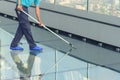 Cleaning glass floor of high building