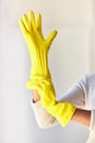 Cleaning gloves, hands and woman in home ready to sanitize for hygiene, wellness and health. Spring cleaning, cleaning