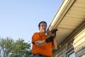 Cleaning Gutters On A Hot Day Royalty Free Stock Photo