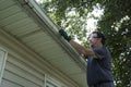 Cleaning Gutters Of Leaves And Sticks Royalty Free Stock Photo