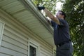 Cleaning Gutters On A Residential Home Royalty Free Stock Photo