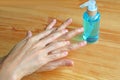 Cleaning Hands with Sanitizer by Right Palm Rubbing over Left Dorsum with Fingers Interlaced for Hand Hygiene Royalty Free Stock Photo