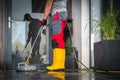 Cleaning His Backyard Garden Patio Using High Pressure Washer Royalty Free Stock Photo