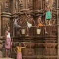 Cleaning a historic Hindu temple in Bhubaneswar, India.