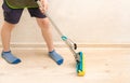 Cleaning the house during the quarantine period. Help children in cleaning the apartment, at home. A child mops floors