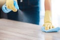 Cleaning, housekeeping and hands with spray bottle on furniture for spring cleaning, dust and dirt on surface. Housework