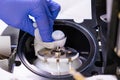 Cleaning of ion source of mass spectrometer by laboratory worker in rubber gloves. LC MS, liquid chromatography and Royalty Free Stock Photo