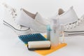 Cleaning kit and white shoes on white background Royalty Free Stock Photo