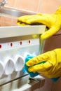 cleaning the kitchen - cleaning the stove, hands with a rag Royalty Free Stock Photo