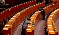 Cleaning ladies dusting tables in EU parliament chamber before meeting