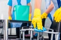 Cleaning ladies working as team in office