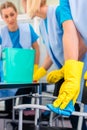 Cleaning ladies working as team in office Royalty Free Stock Photo