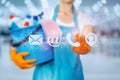 Cleaning lady clicks on the contact icon on a blurred background