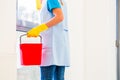 Cleaning lady with cloth at window Royalty Free Stock Photo