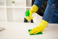 The cleaning lady does the cleaning in the office with a wet cloth Royalty Free Stock Photo