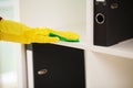 The cleaning lady does the cleaning in the office with a wet cloth Royalty Free Stock Photo